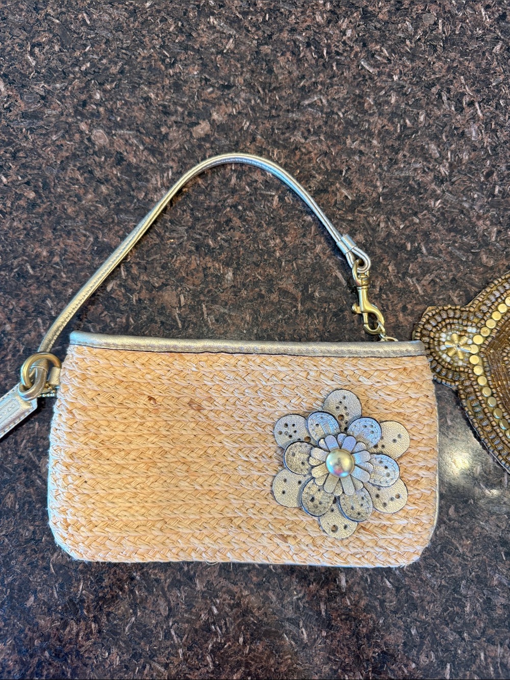 Coach Straw Wristlet with Gold Leather Trim and Floral Accent